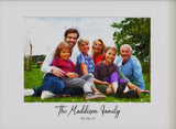 portrait of the Maddison family sitting on the grass